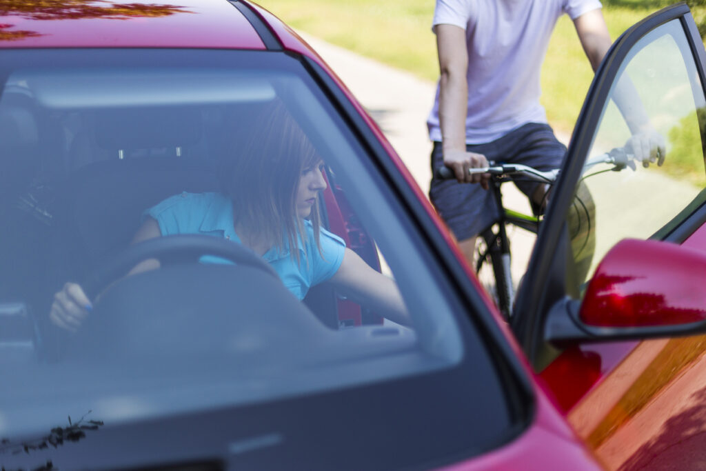 Open car door puts cyclists in great danger